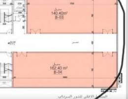  الشويخ خلف شارع الزينة مخزنين  مساحه اول واحد  141 متر وثاني 163 متر 